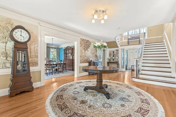 a living room with fireplace furniture and a wooden floor
