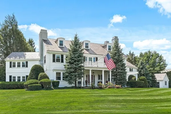 a view of a brick house with a yard
