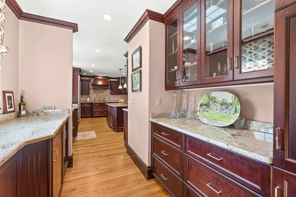 a kitchen with granite countertop stainless steel appliances and a counter space