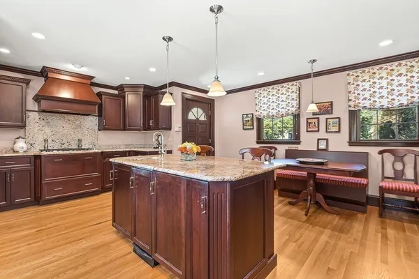 a kitchen with a sink stove and wooden cabinets