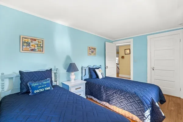 a bedroom with a bed and a chair