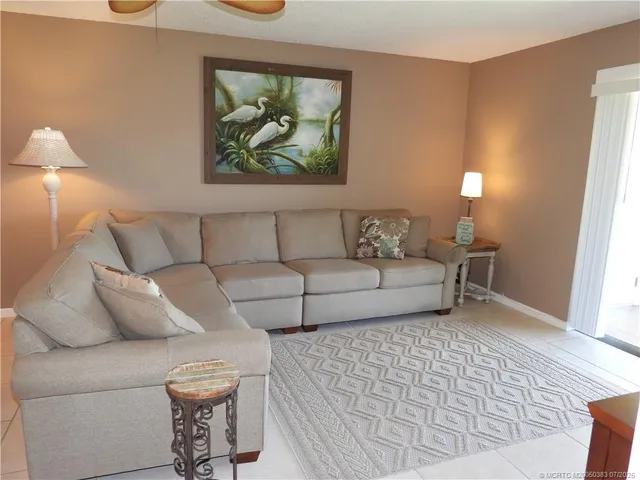 a swimming pool view with a outdoor seating