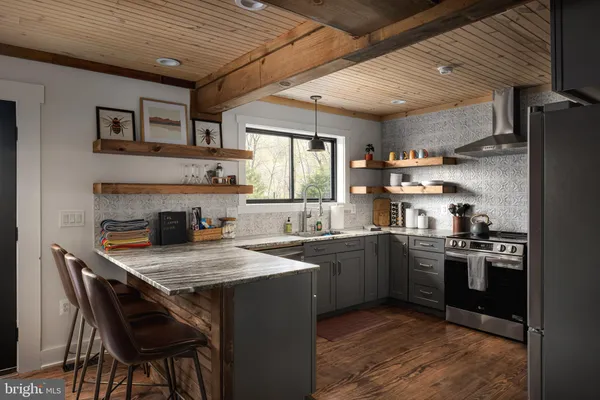 a kitchen with a stove and cabinets
