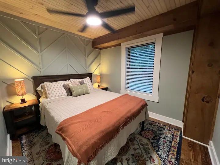 529 Posy Hill Road Lost City, WV 26810 - Photo 20 of 59 a bed sitting in a bedroom next to a window