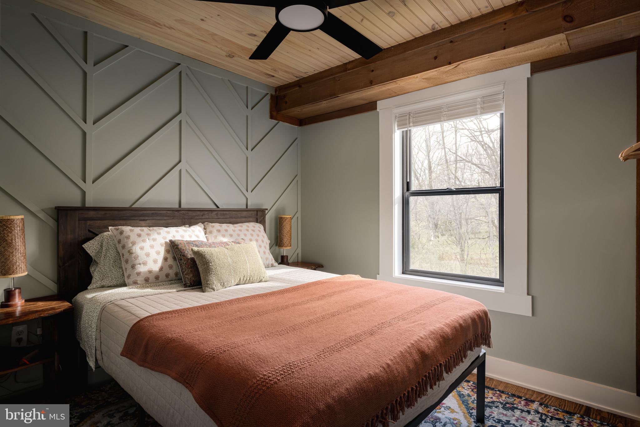 529 Posy Hill Road Lost City, WV 26810 - Photo 21 of 59 a bedroom with a bed and window
