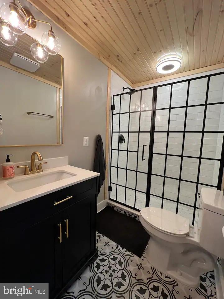 529 Posy Hill Road Lost City, WV 26810 - Photo 22 of 59 a bathroom with a sink toilet and shower