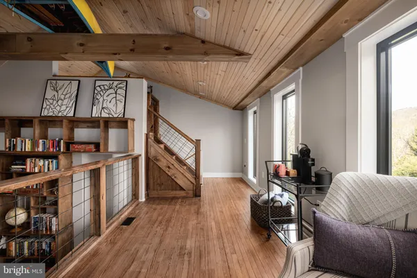 a view of staircase with a rug