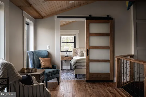a en suite bathroom with a double vanity sink and a mirror