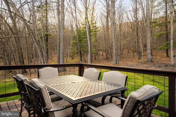 a view of a dry yard with mountains in the background