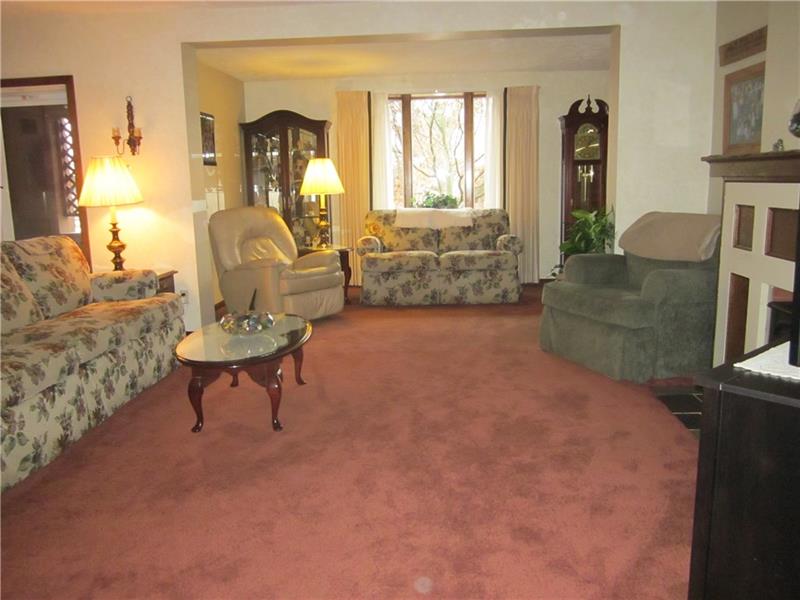 1003 Freeport Road Natrona Heights, PA 15065 - Photo 5 of 22 open floor plan shows off this living room. Seller says hardwood under carpet!