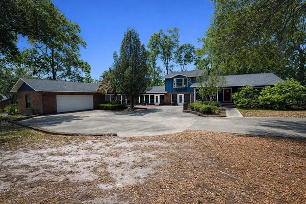 a view of a house with a yard
