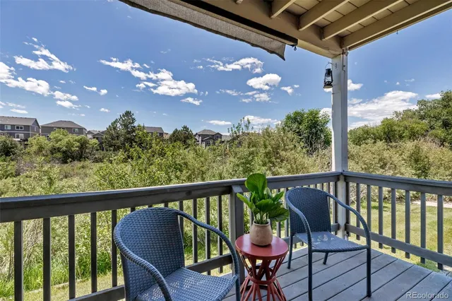 a view of a chair and table in the balcony