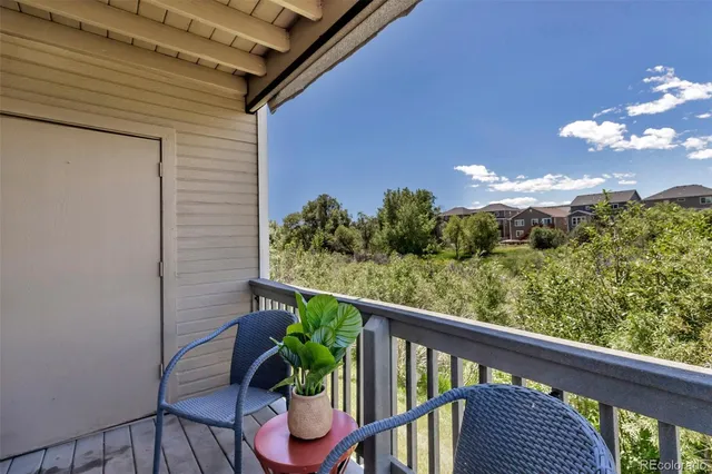 a view of kitchen with refrigerator microwave and stove