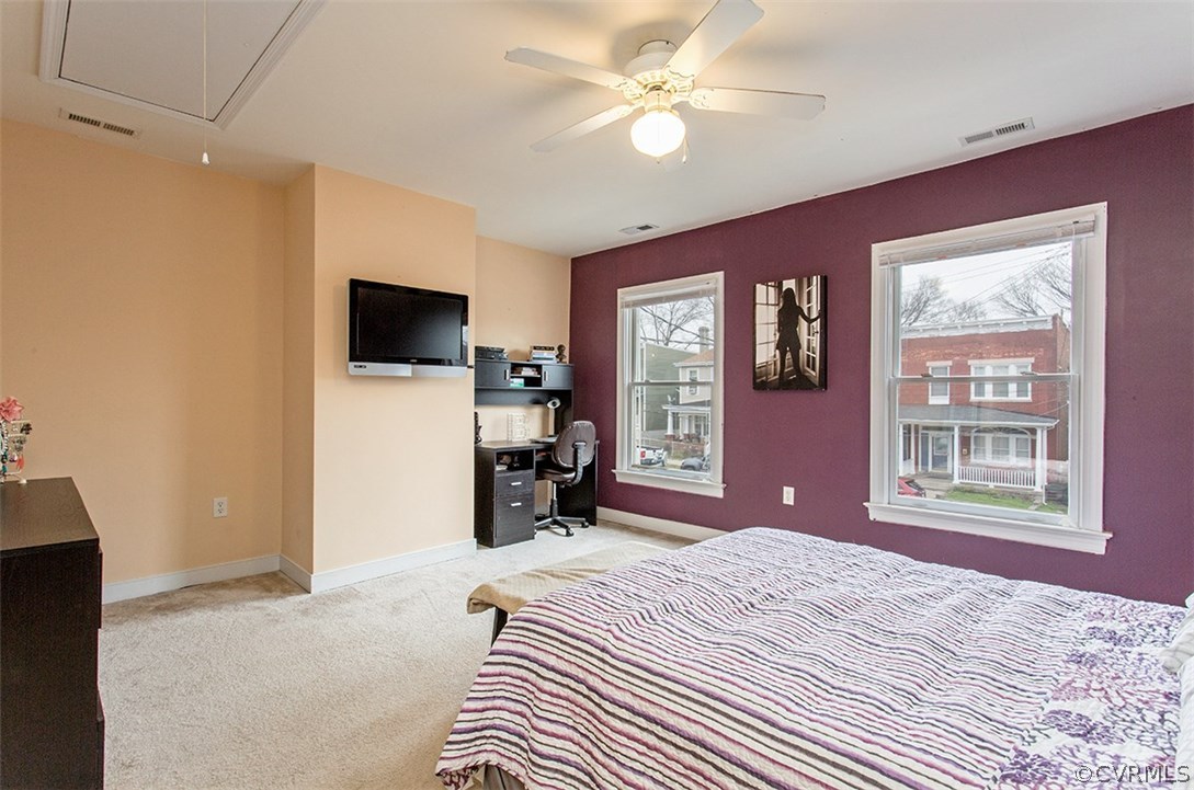 1317 Decatur Street Richmond, VA 23224 - Photo 11 of 18 a bedroom with a bed and a flat screen tv