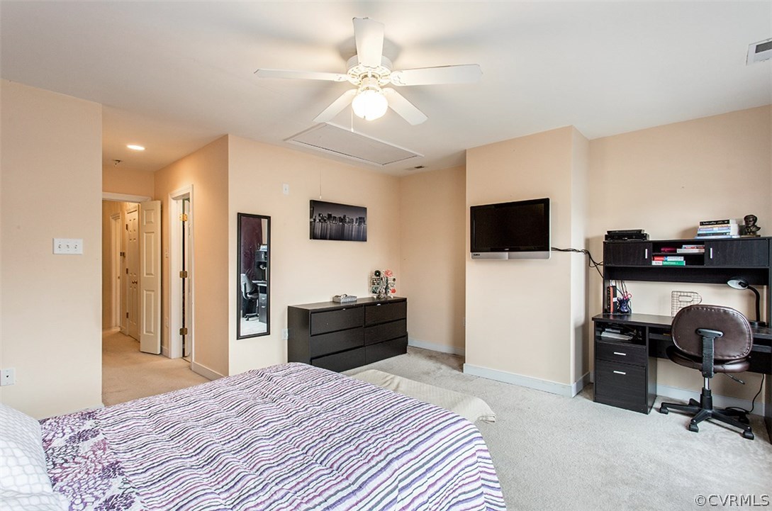 1317 Decatur Street Richmond, VA 23224 - Photo 12 of 18 a bedroom with a bed and a flat screen tv