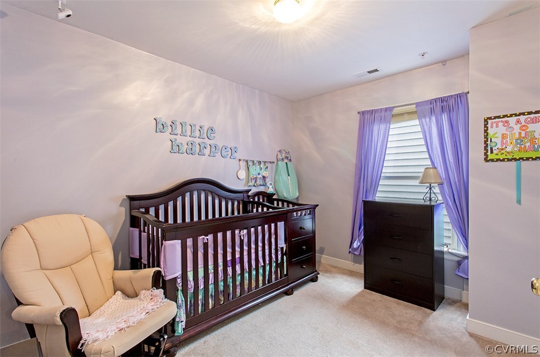 1317 Decatur Street Richmond, VA 23224 - Photo 15 of 18 a bedroom with furniture and a window