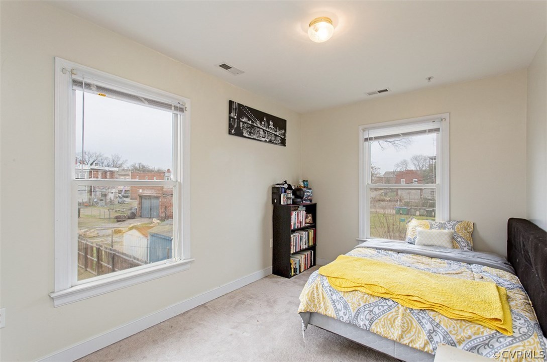 1317 Decatur Street Richmond, VA 23224 - Photo 16 of 18 a bedroom with a bed and a window