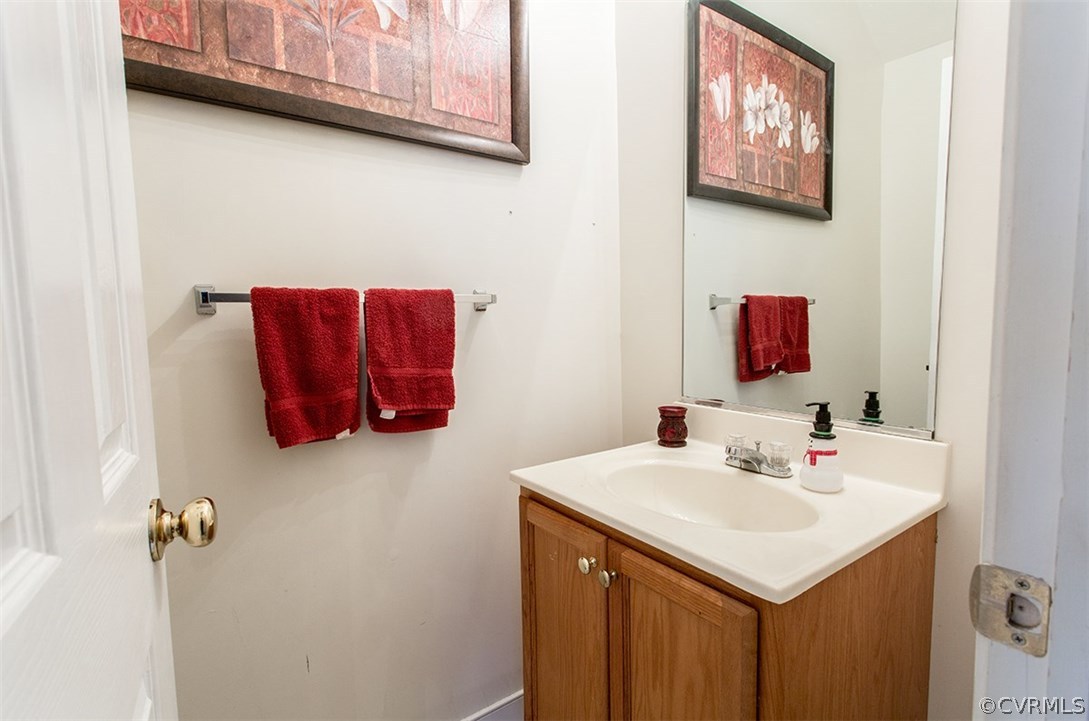 1317 Decatur Street Richmond, VA 23224 - Photo 8 of 18 a bathroom with a sink and a mirror