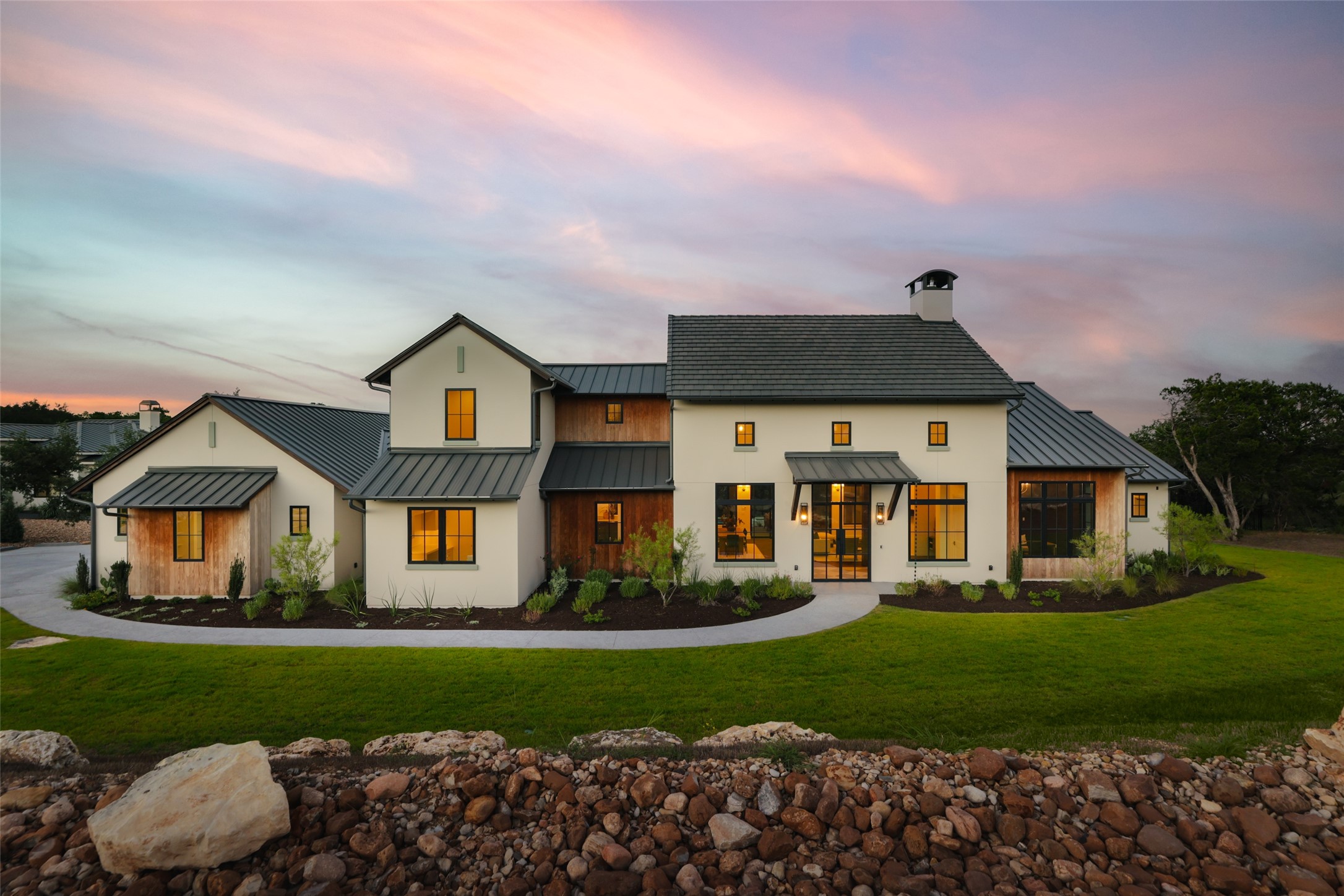125 Broadwing Cove Austin, TX 78737 - Photo 2 of 40 a front view of a house with a yard and outdoor seating