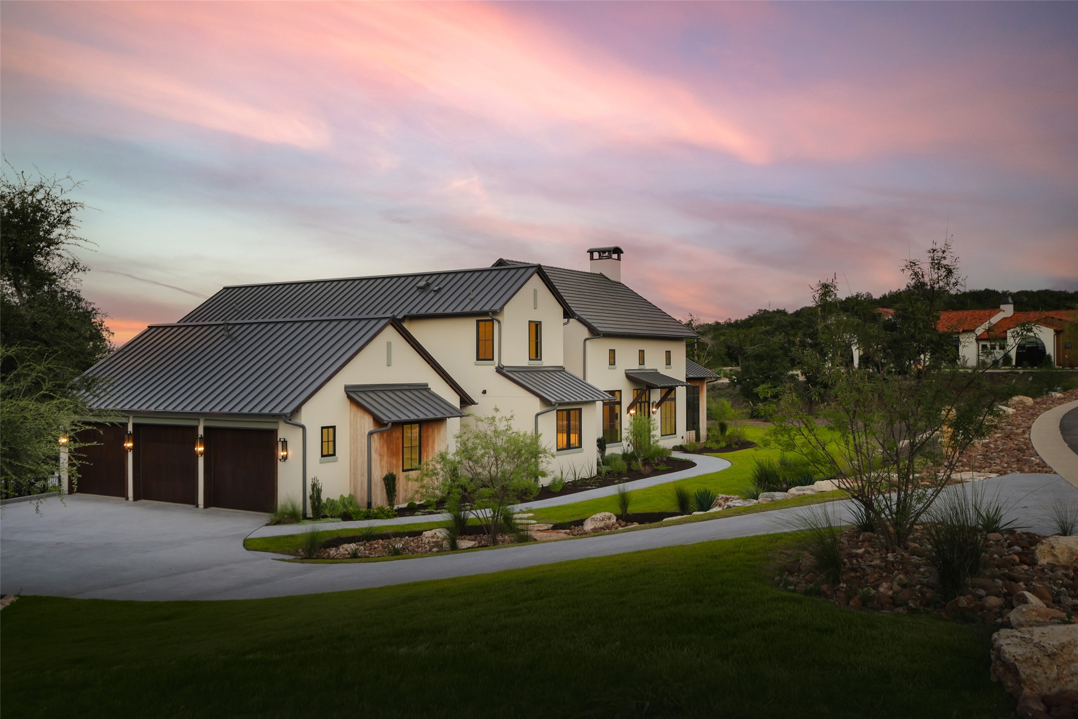 125 Broadwing Cove Austin, TX 78737 - Photo 3 of 40 a view of house with garden and tall trees
