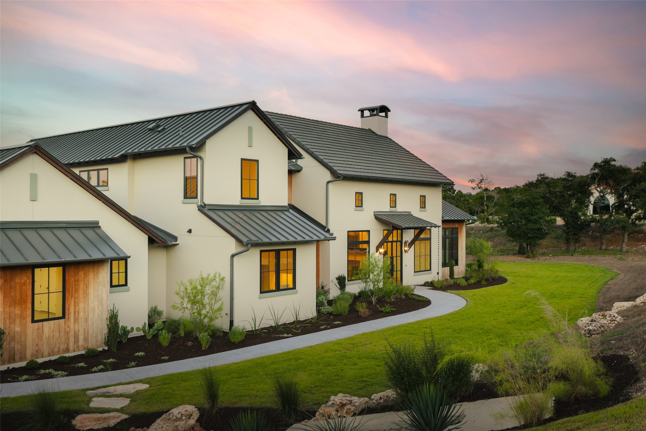 125 Broadwing Cove Austin, TX 78737 - Photo 4 of 40 Privacy on a sprawling 1-acre lot. Located at the corner of Broadwing Cove, this home is situated on a deep, 1.06-acre cul-de-sac lot that offers significant separation from neighbors. The wide front setback and native landscaping emphasize the sense of space and quiet that defines the Hawkridge lifestyle.
