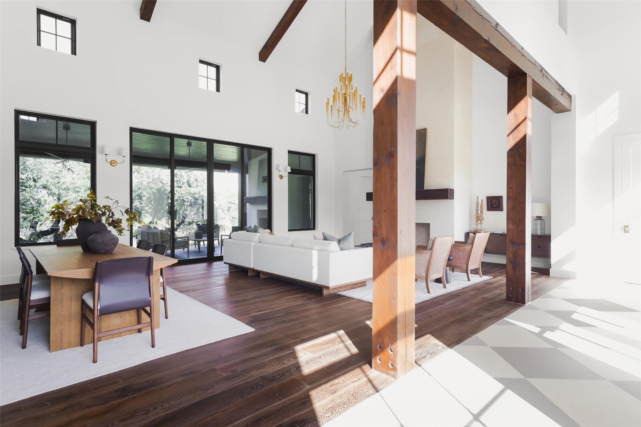 125 Broadwing Cove Austin, TX 78737 - Photo 5 of 40 a living room with couches a dining table and chairs with wooden floor