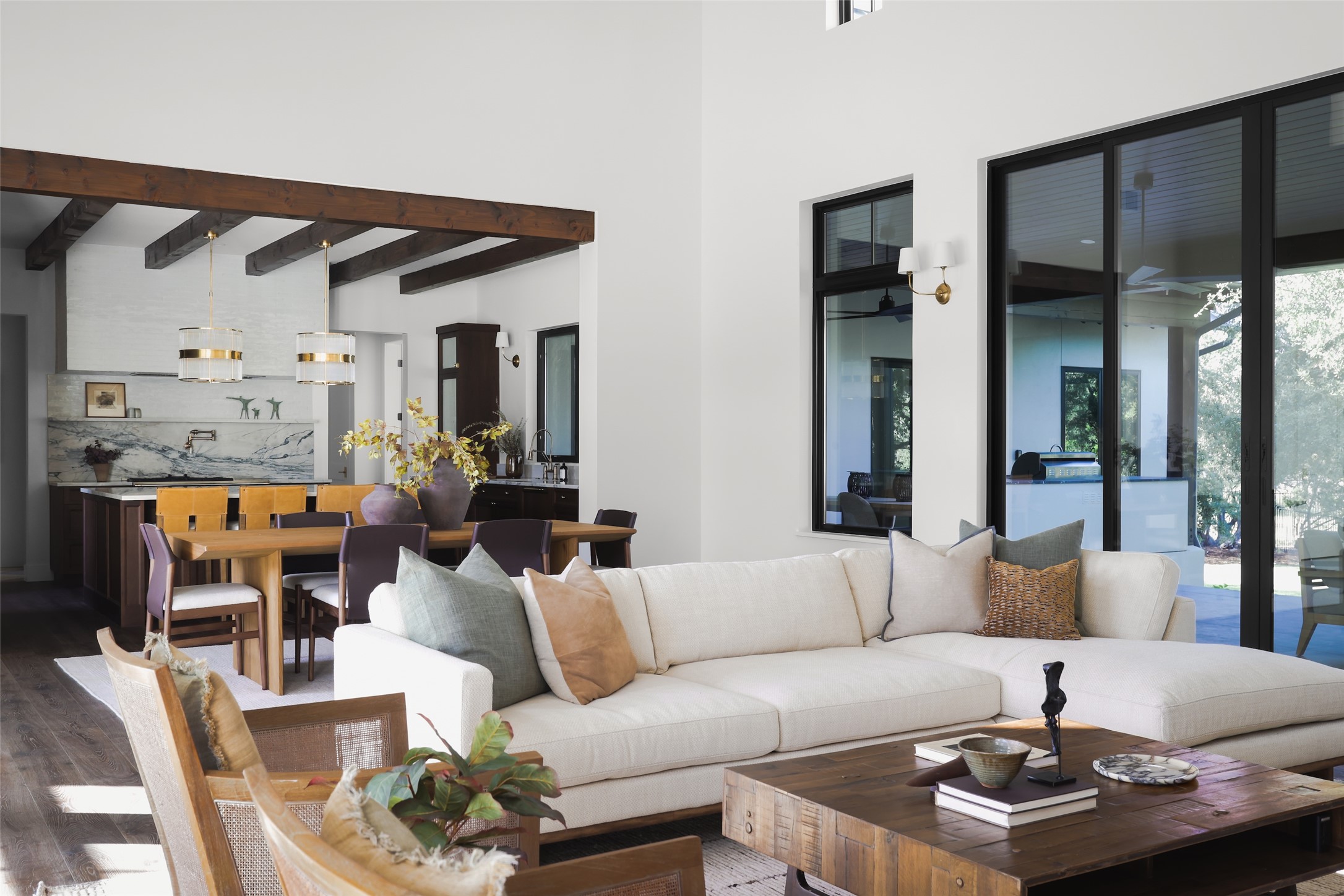 125 Broadwing Cove Austin, TX 78737 - Photo 9 of 40 a living room with furniture and a chandelier