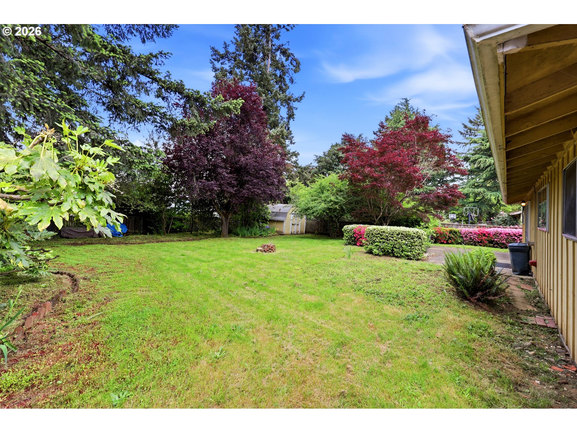 3003 Southeast 162nd Avenue Portland, OR 97236 - Photo 25 of 41 a view of a garden with a fountain