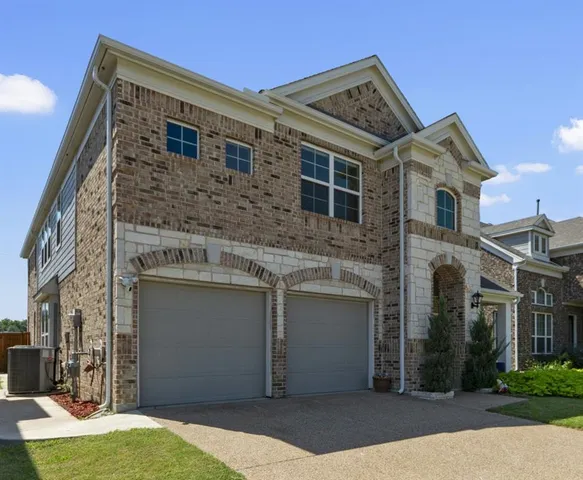 a front view of a house with yard