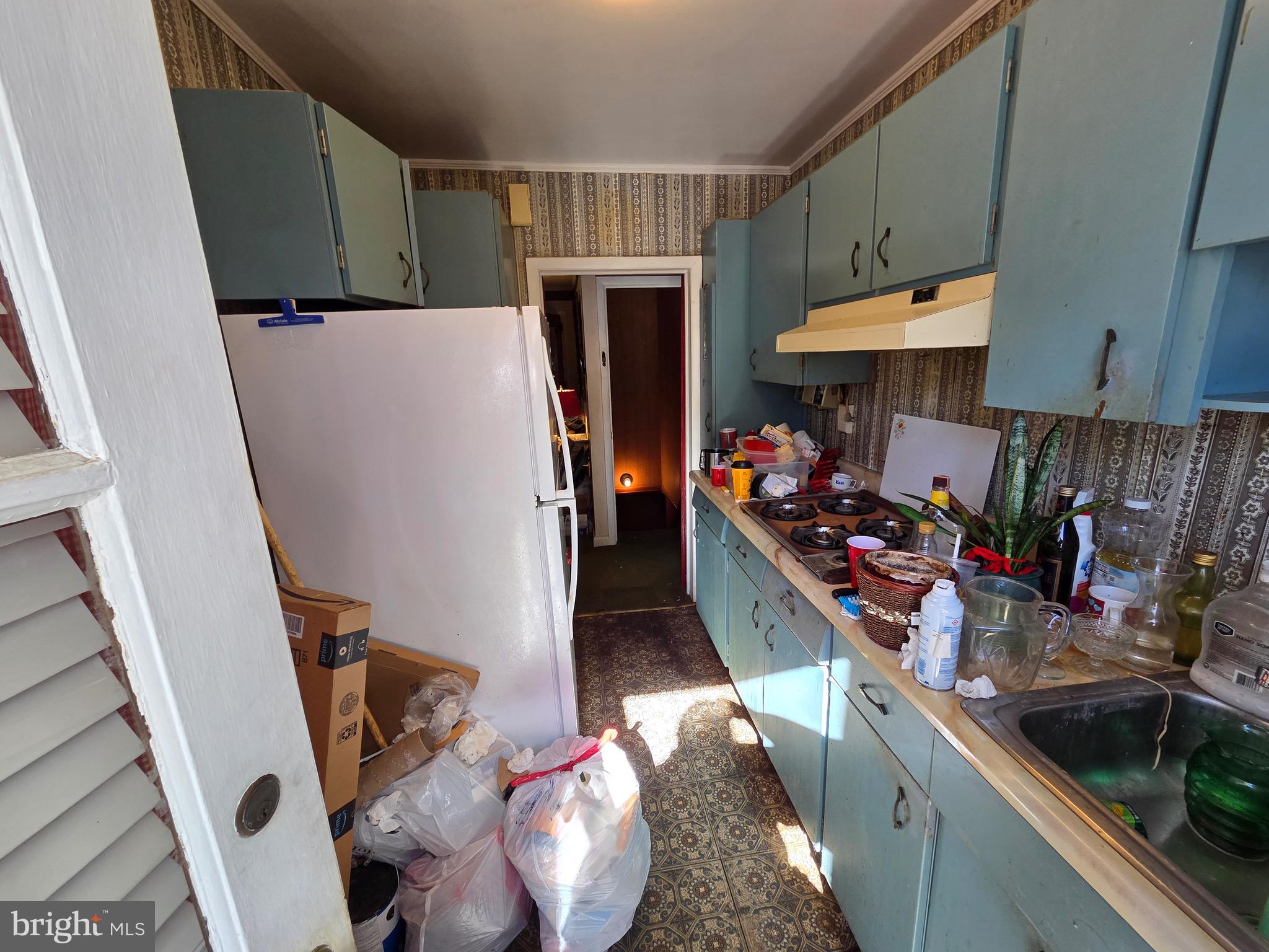 12 Collins Lane Maple Shade, NJ 08052 - Photo 4 of 20 a kitchen with a refrigerator and a sink
