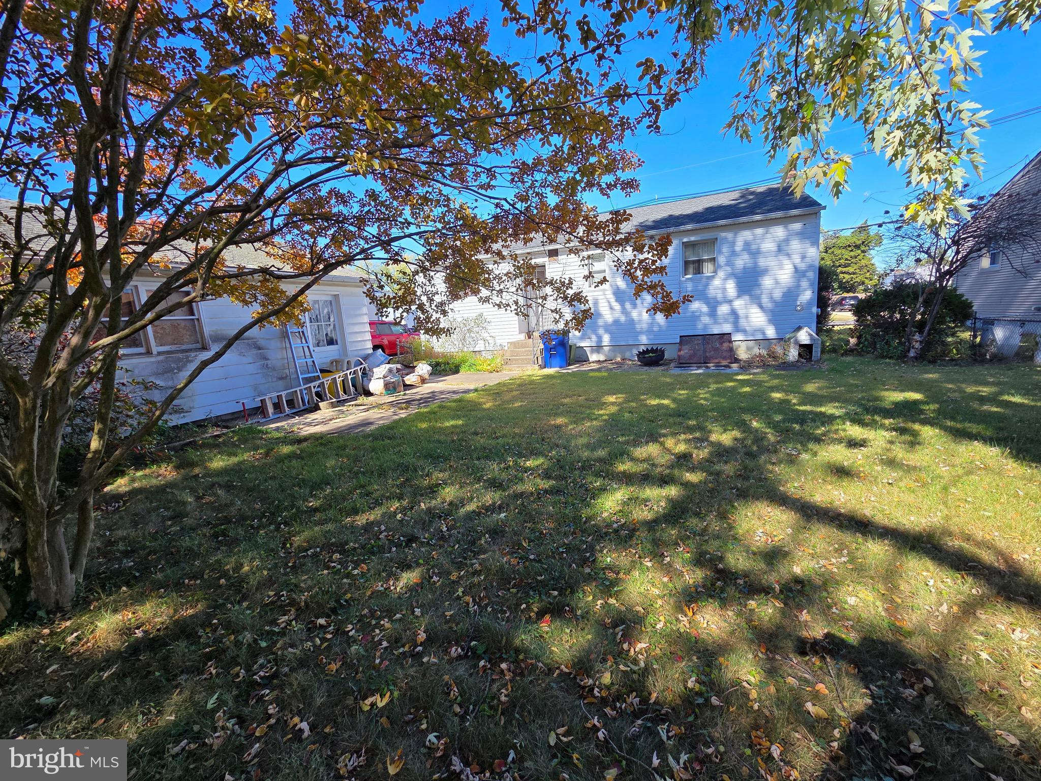 12 Collins Lane Maple Shade, NJ 08052 - Photo 7 of 20 a backyard of a house with lots of green space and fountain