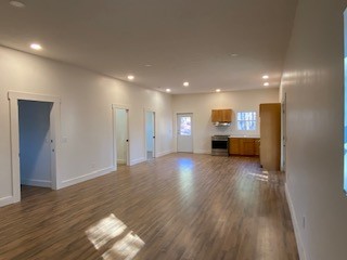 221 Howard Switch Road Hohenwald, TN 38462 - Photo 16 of 20 a view of empty room with wooden floor