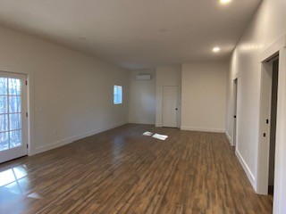 221 Howard Switch Road Hohenwald, TN 38462 - Photo 7 of 20 a view of a livingroom with wooden floor and window