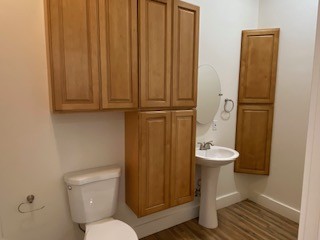 221 Howard Switch Road Hohenwald, TN 38462 - Photo 10 of 20 a white toilet sitting next to a bathroom sink