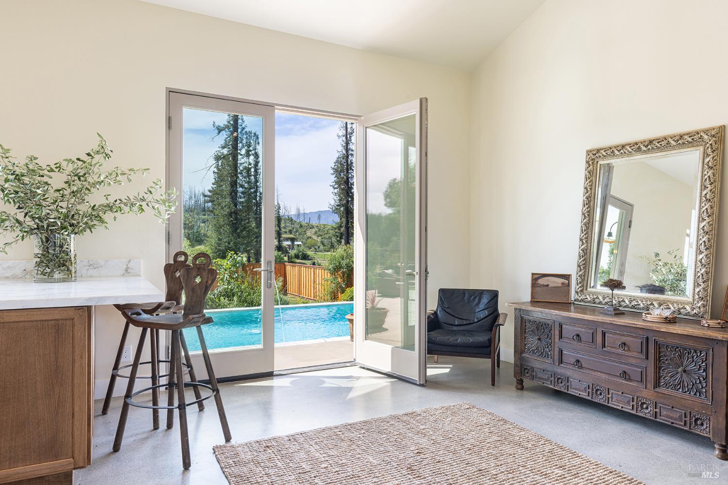753 Sunnyside Road St. Helena, CA 94574 - Photo 18 of 55 a living room with furniture and a floor to ceiling window