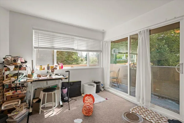 a room with gym equipment and a large window