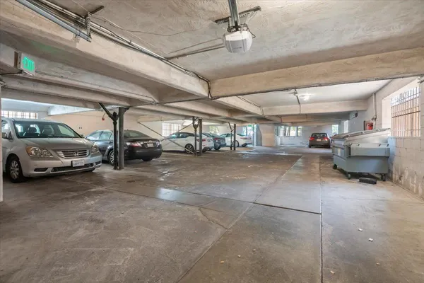 a view of parking garage with cars