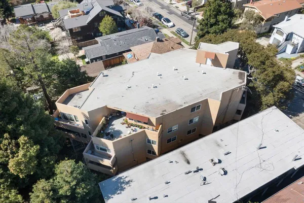 an aerial view of a house with yard