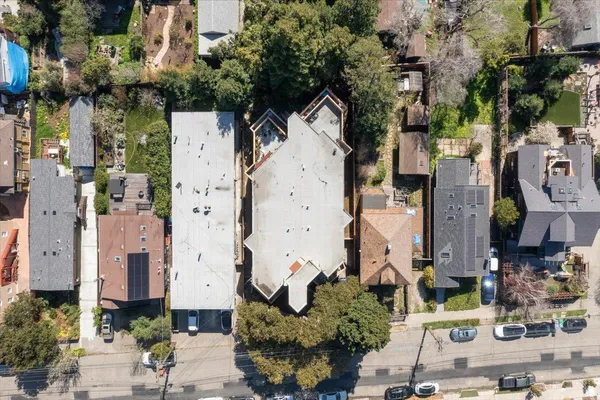 an aerial view of a house with outdoor space