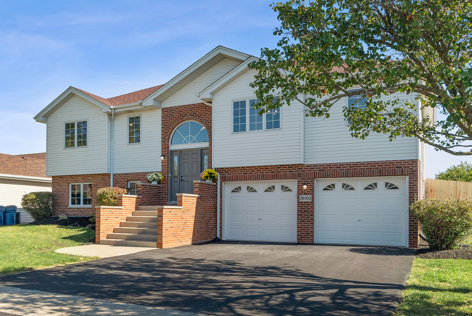26103 South Ruby Street Monee, IL 60449 - Photo 1 of 2 a front view of a house with a yard