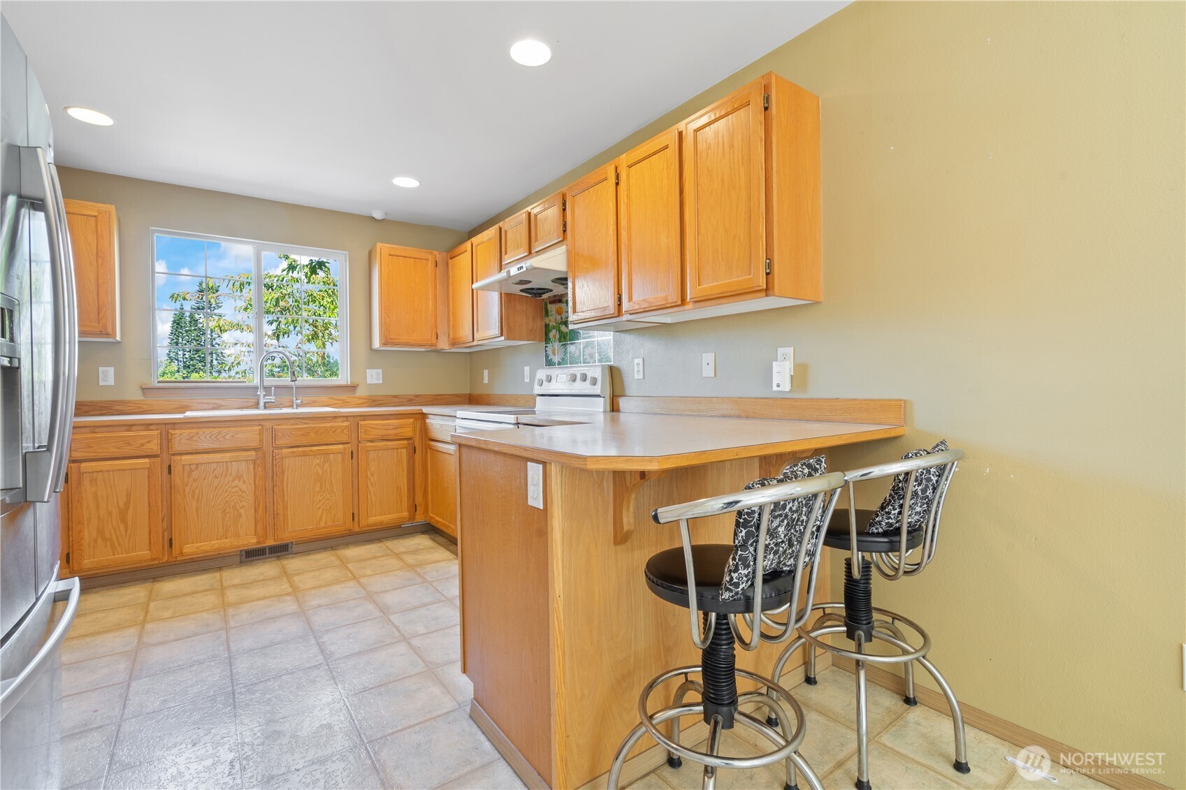 5620 Seahurst Avenue Everett, WA 98203 - Photo 4 of 28 a kitchen with a sink cabinets and window