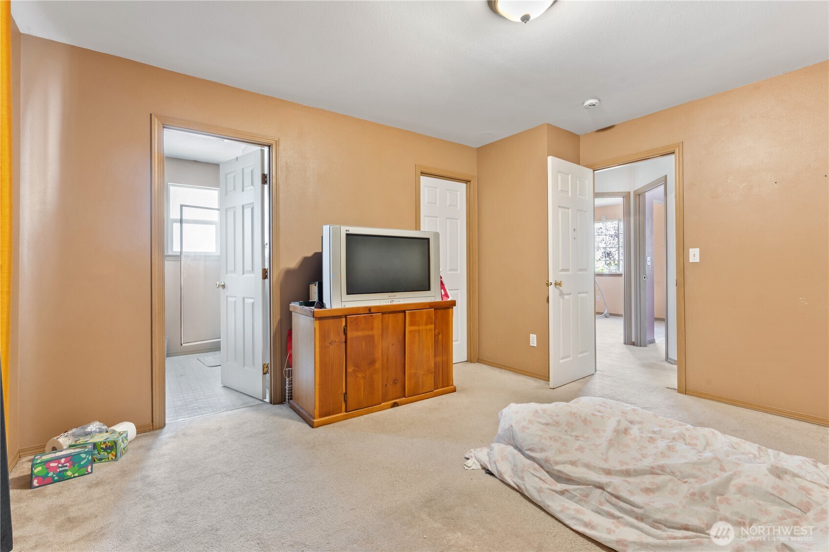 5620 Seahurst Avenue Everett, WA 98203 - Photo 8 of 28 a bedroom with a bed and a flat screen tv