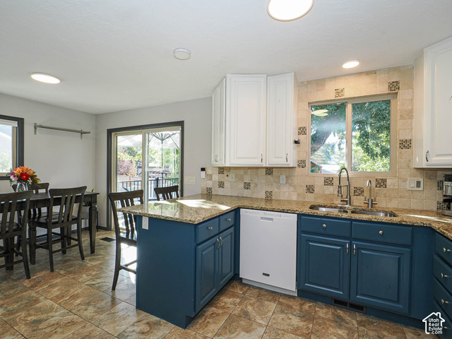 3308 Willow Ridge Road Salt Lake City, UT 84121 - Photo 33 of 59 Kitchen featuring blue base cabinetry, white upper cabinetry, granite countertops, tile flooring, and a tiled backsplash