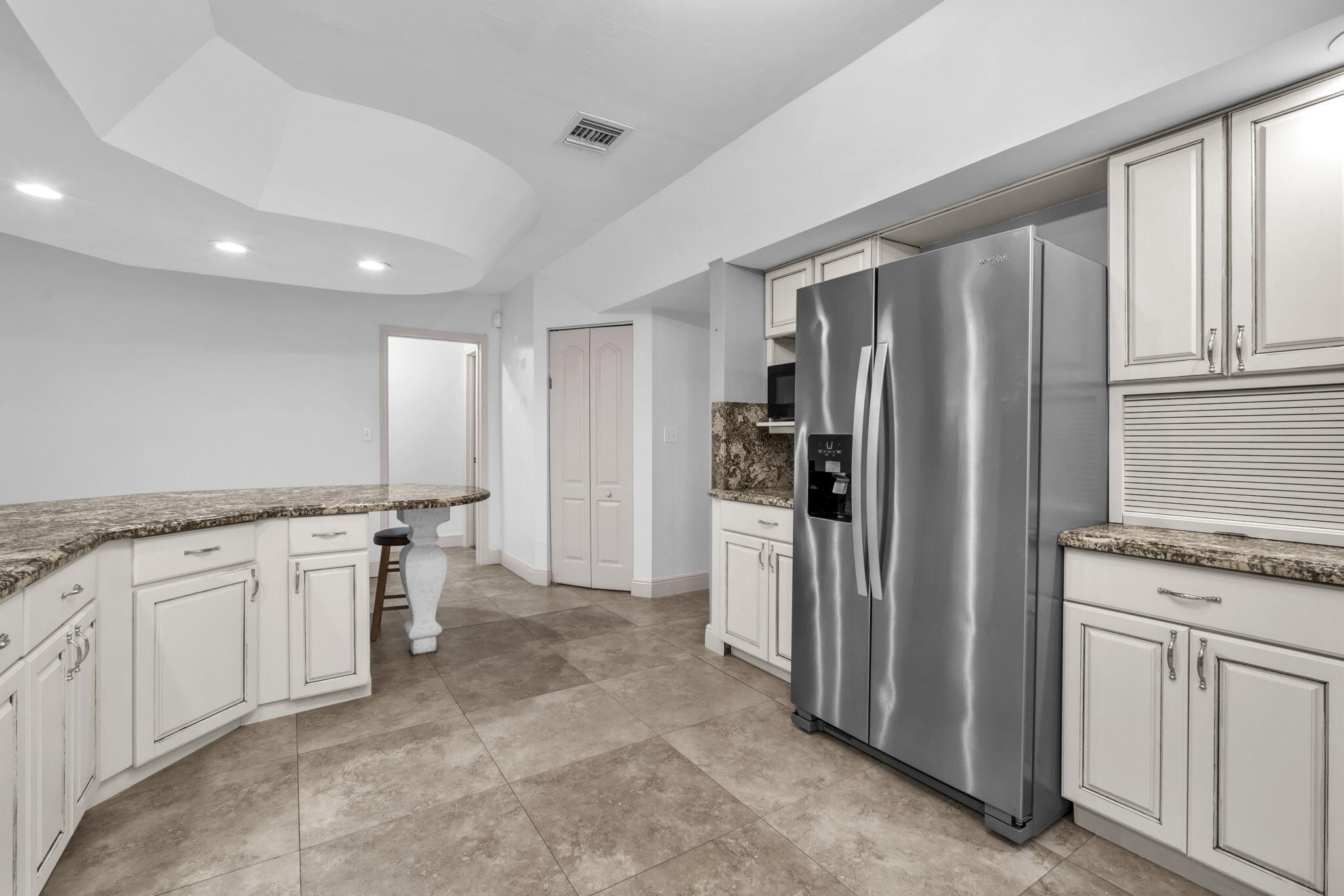 15225 Southwest 235th Street Homestead, FL 33032 - Photo 11 of 96 a kitchen with stainless steel appliances granite countertop a refrigerator and a stove