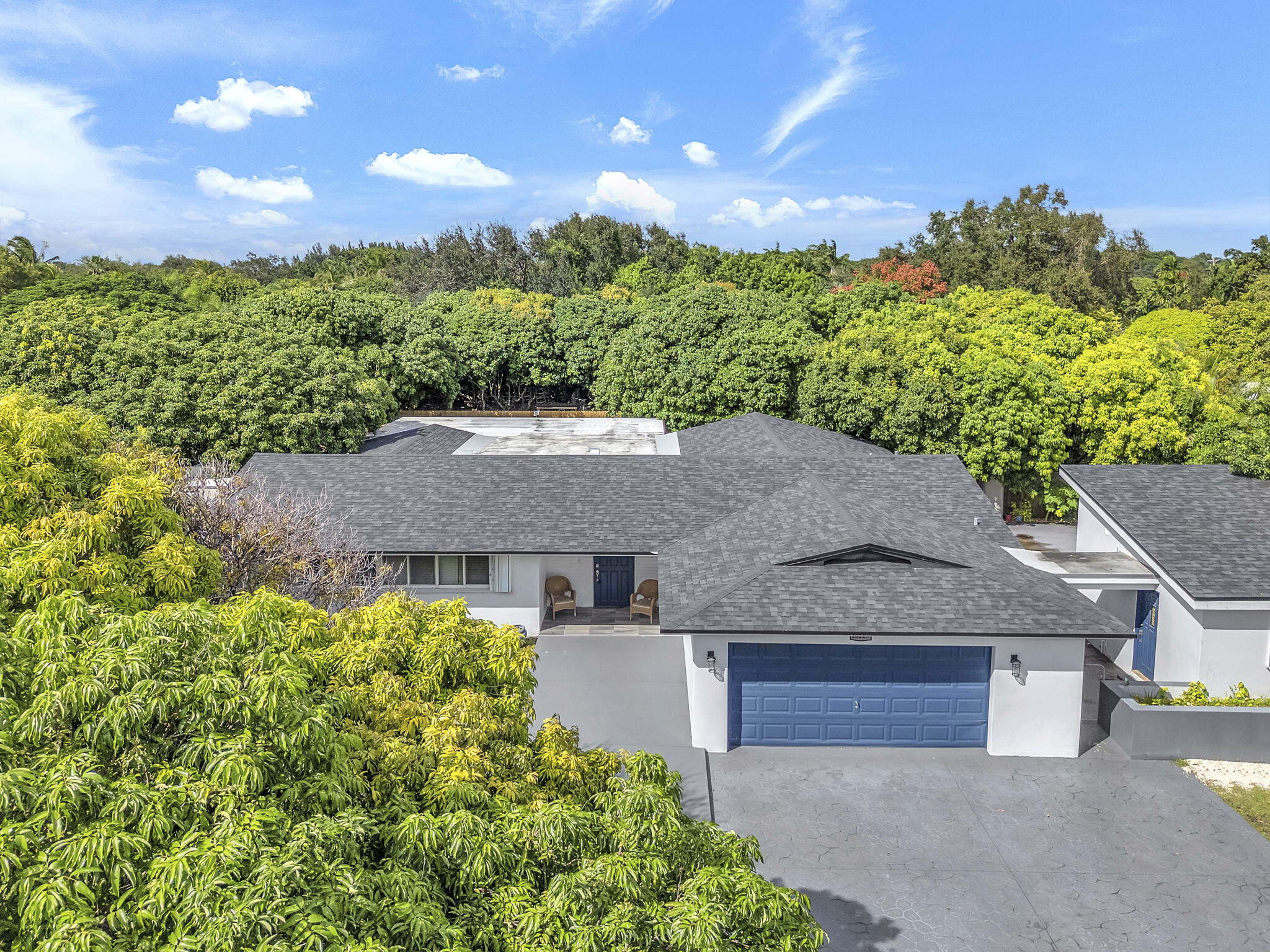 15225 Southwest 235th Street Homestead, FL 33032 - Photo 2 of 96 an aerial view of a house with a yard and lake view