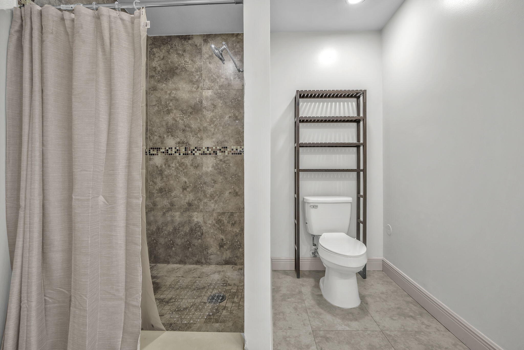 15225 Southwest 235th Street Homestead, FL 33032 - Photo 21 of 96 a bathroom with a toilet and a shower