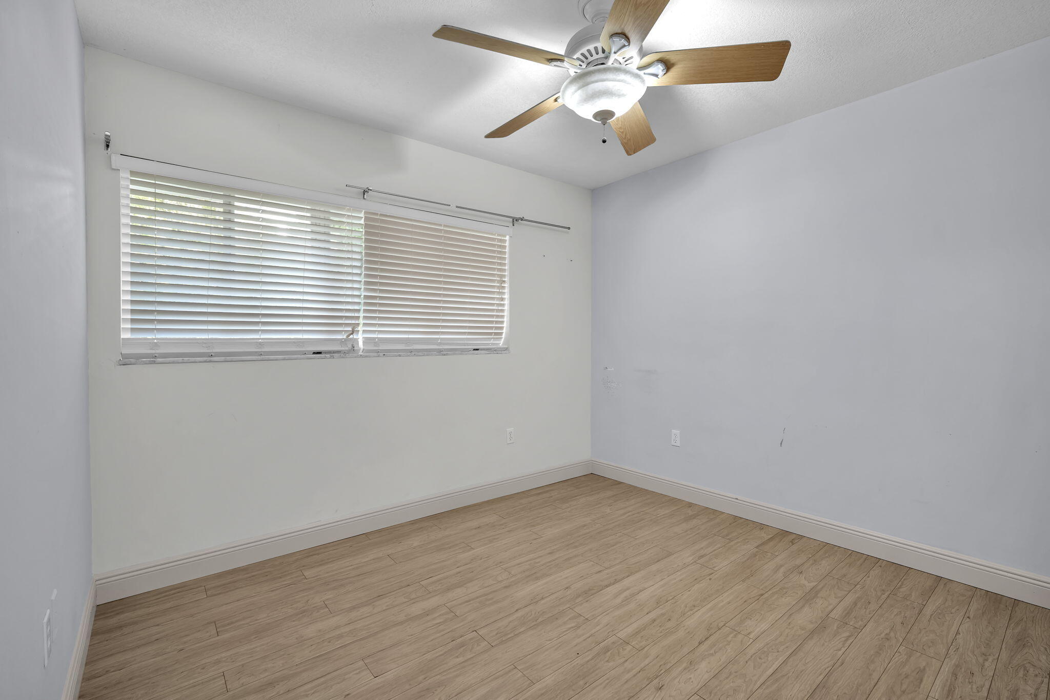15225 Southwest 235th Street Homestead, FL 33032 - Photo 23 of 96 an empty room with a window and a fan