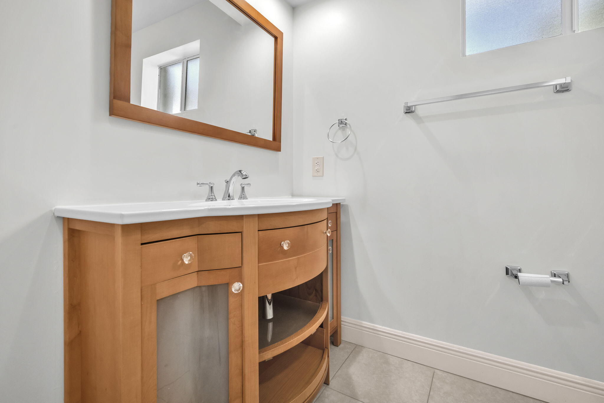 15225 Southwest 235th Street Homestead, FL 33032 - Photo 24 of 96 a bathroom with a sink and a mirror