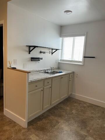 15225 Southwest 235th Street Homestead, FL 33032 - Photo 36 of 96 a kitchen with a sink cabinets and window