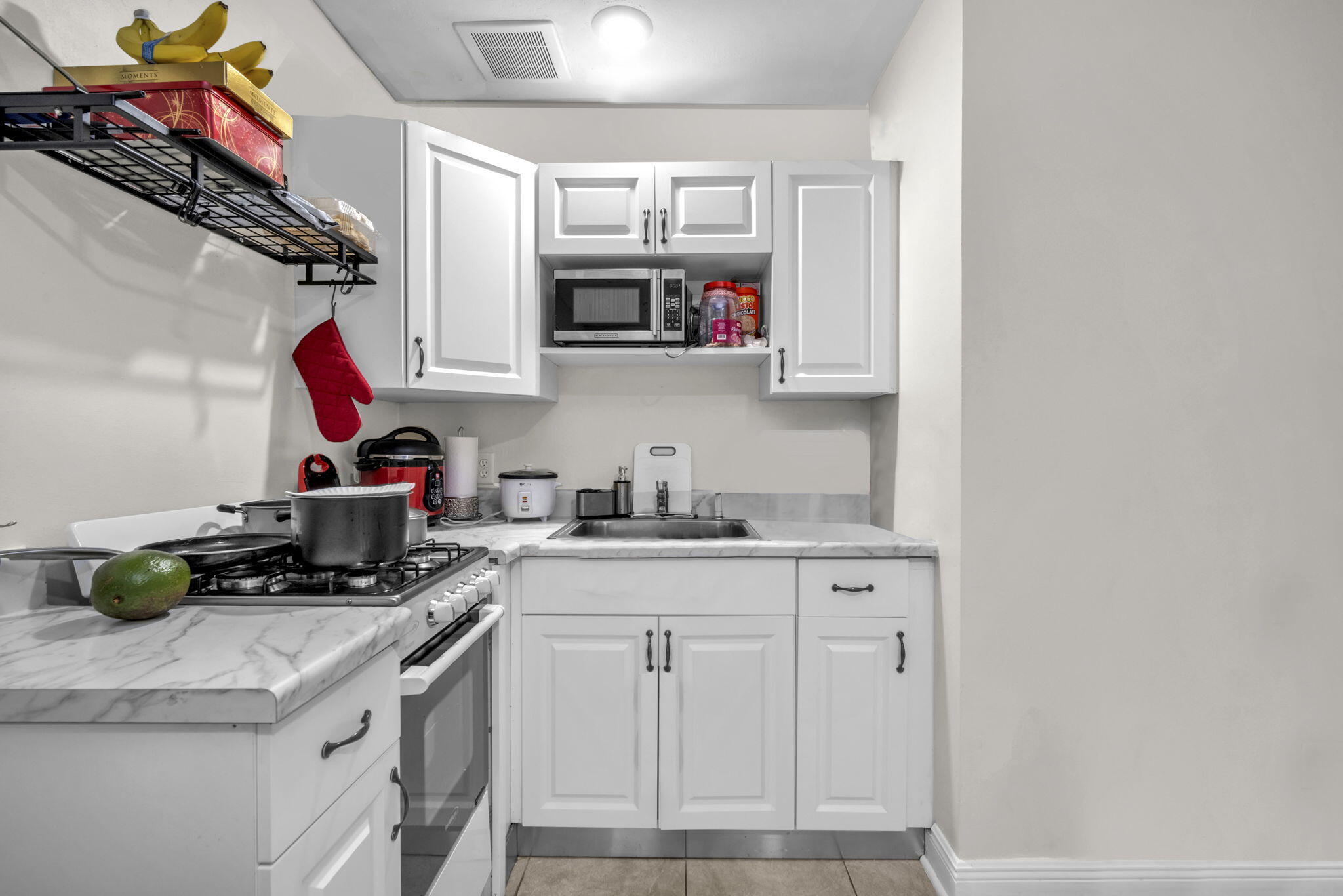 15225 Southwest 235th Street Homestead, FL 33032 - Photo 43 of 96 a kitchen with stainless steel appliances granite countertop a sink and cabinets